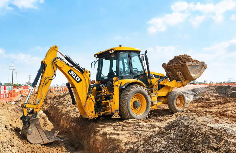 JCB backhoe loader on utility jobsite