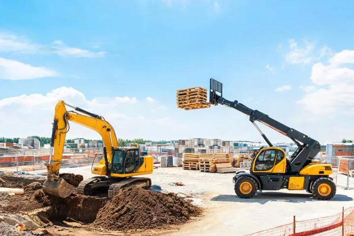 Matched JCB backhoe and telehandler working efficiently